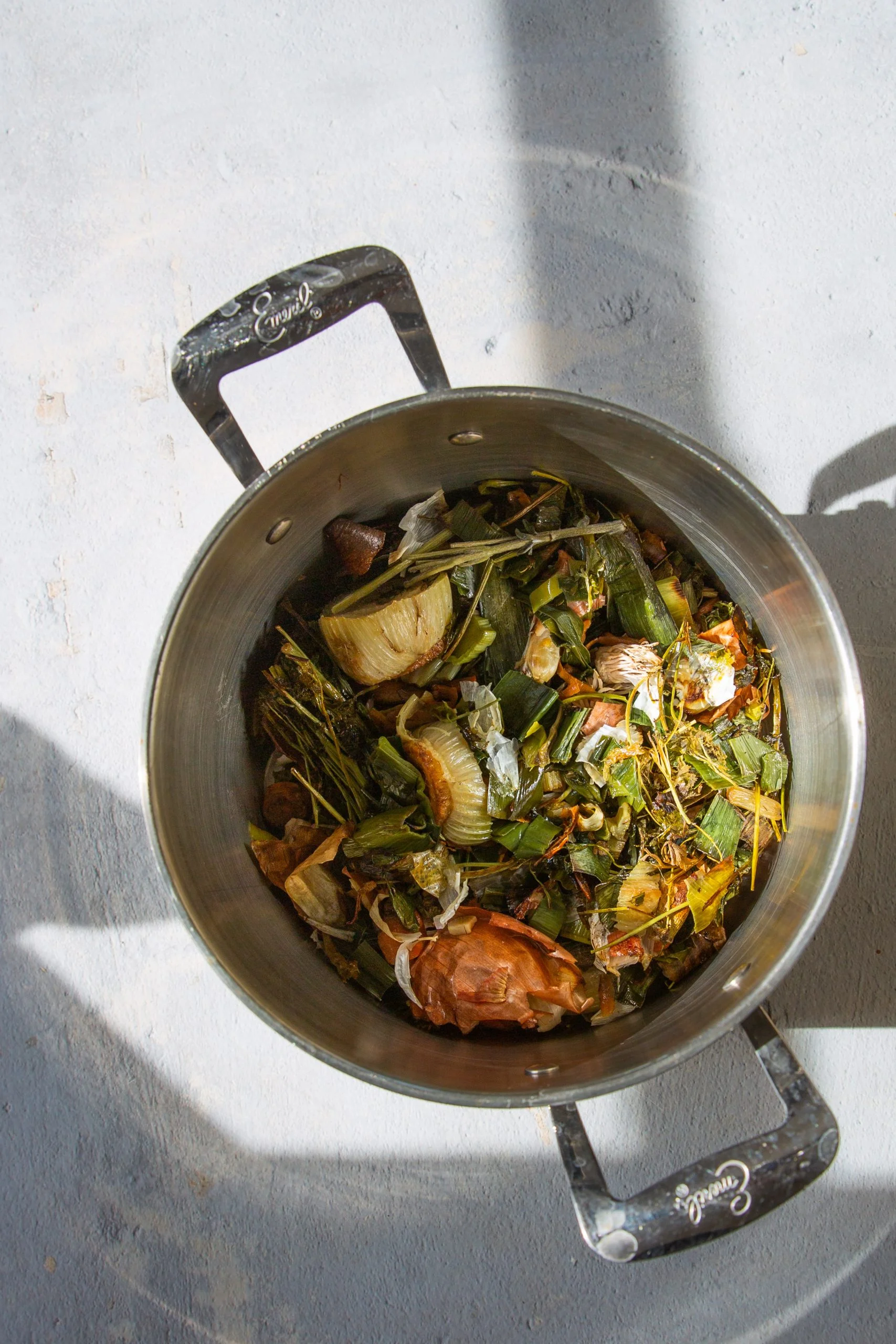 roasted vegetable scaraps in a soup pot