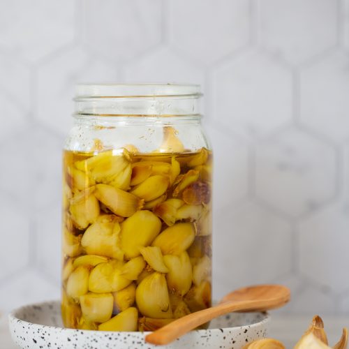 garlic cloves in jar with oil