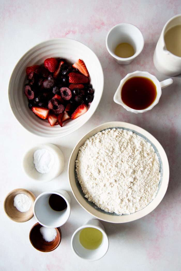 ingredienst in different bowls for blueberry muffins