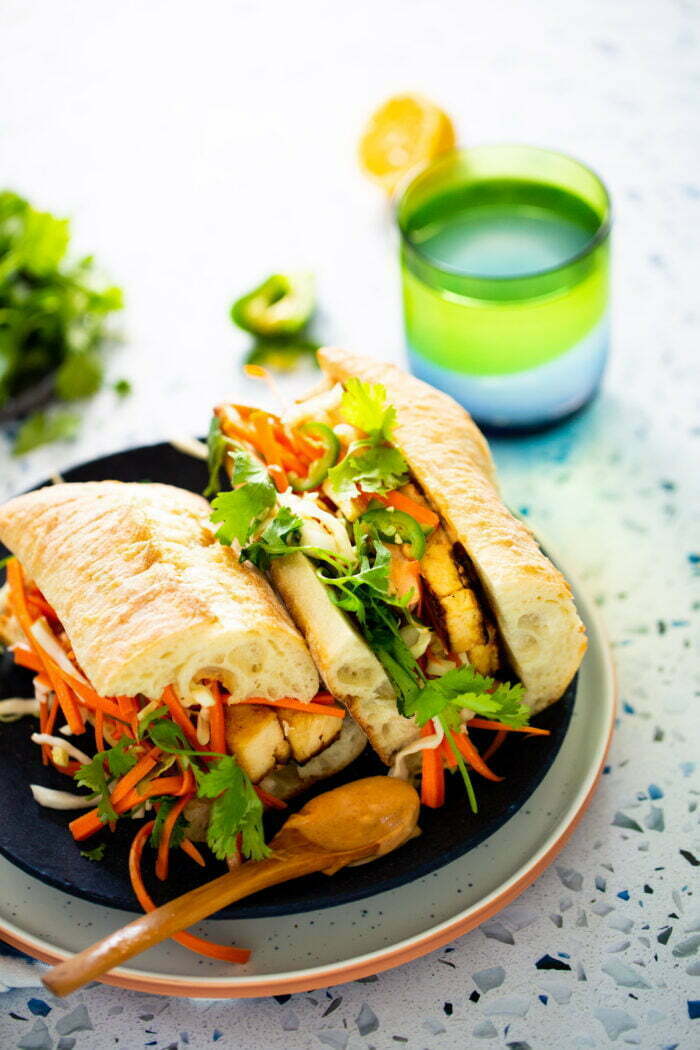 vegan banh mi served on a blue plate 