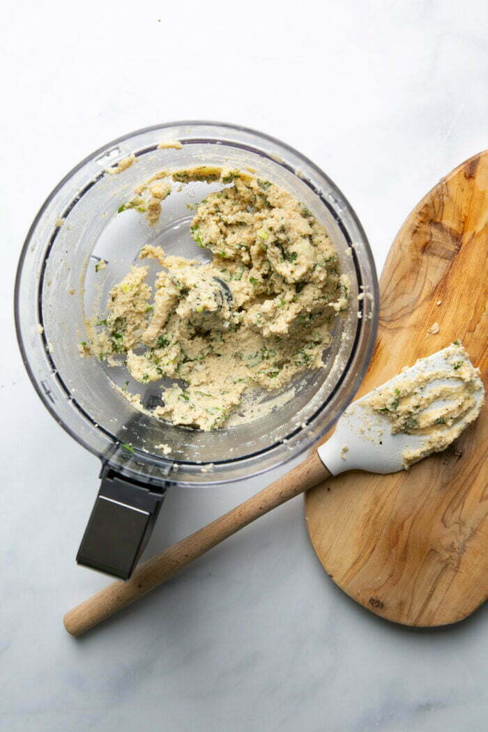 freshly made cashew cream cheese with chopped fresh herbs