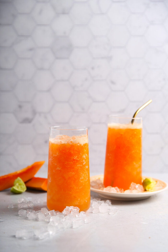 Two glasses with ice and papaya juice