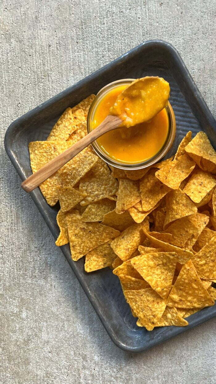 ROASTED HABANERO MANGO SALSA in a mason jar with tortilla chips.