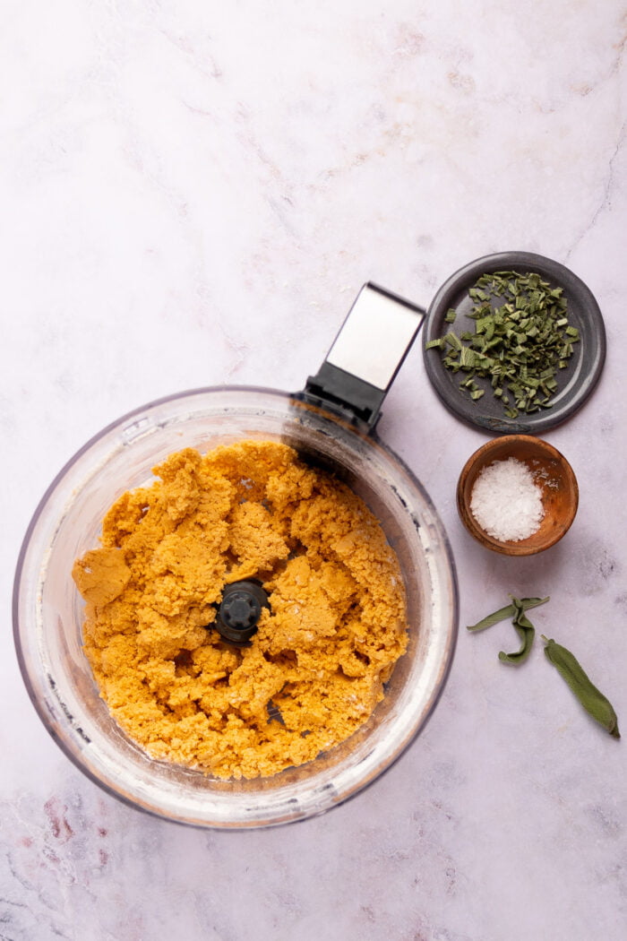 sweet potato roll dough in food processor container.