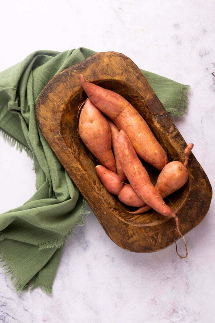 sweet potatoes and a wood platter