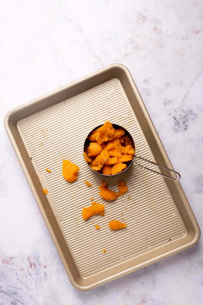 mashed sweet potato over baking sheet