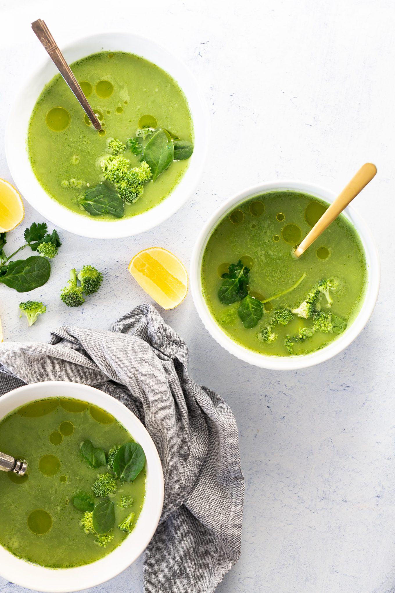 Three bowls of vegan broccoli soup.