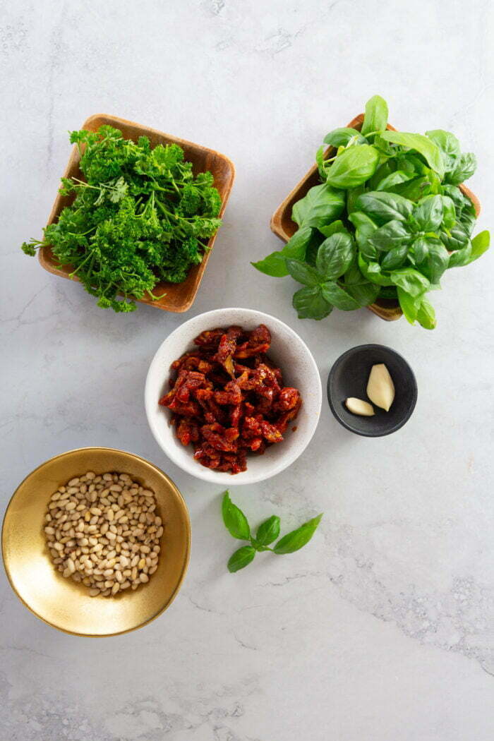 Basil, parsley, sun dried tomatoes, pine nuts and garlic.