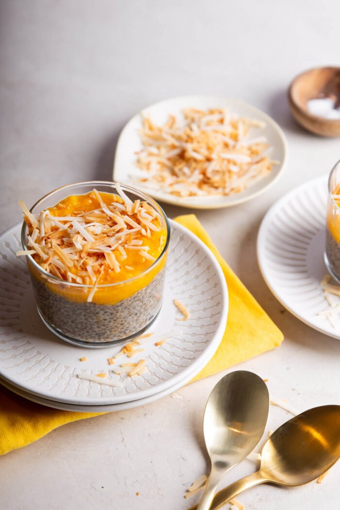 mango chia seed pudding topped with shredded coconut
