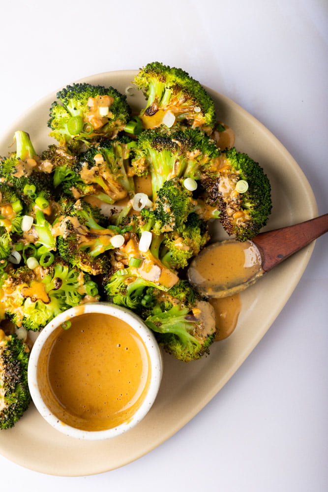 Roasted broccoli topped with Asian peanut sauce and a few slices of scallion.