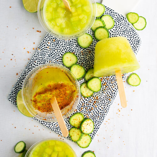 A tray of popsicles with limes and cucumbers, automatic eraser.