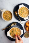 three bowls of vegan italian sausage gnocchi soup