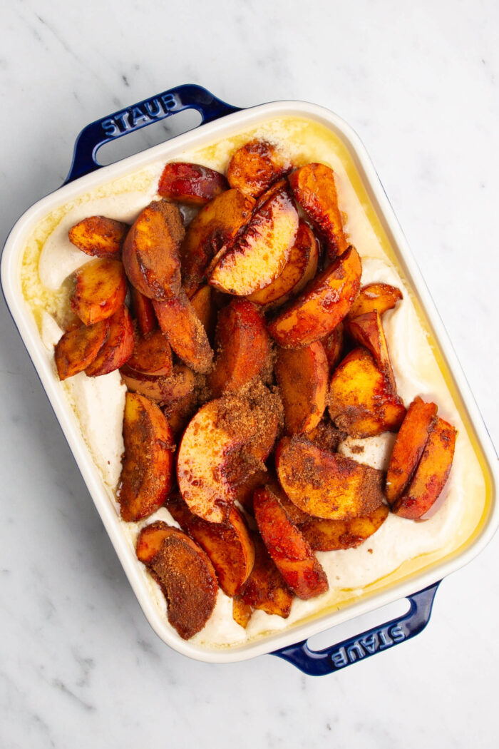 The Magic of Homemade Peach Cobbler served in a baking dish.