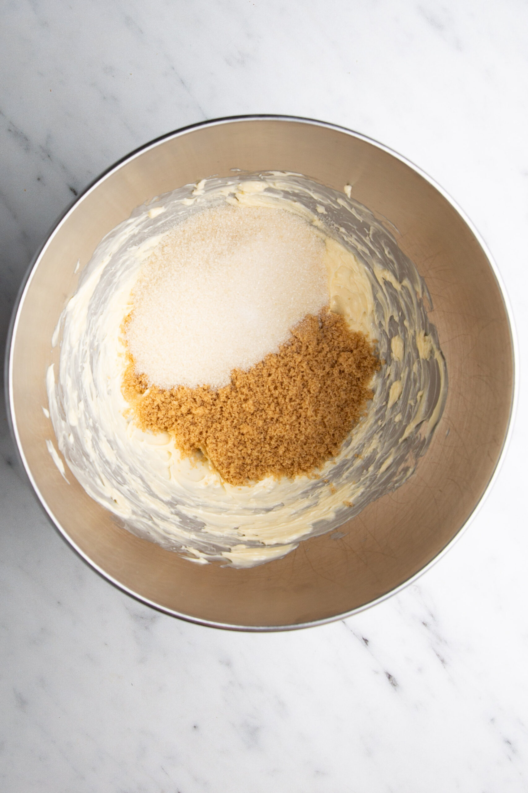 A metal bowl with delicious oatmeal cookies ingredients.