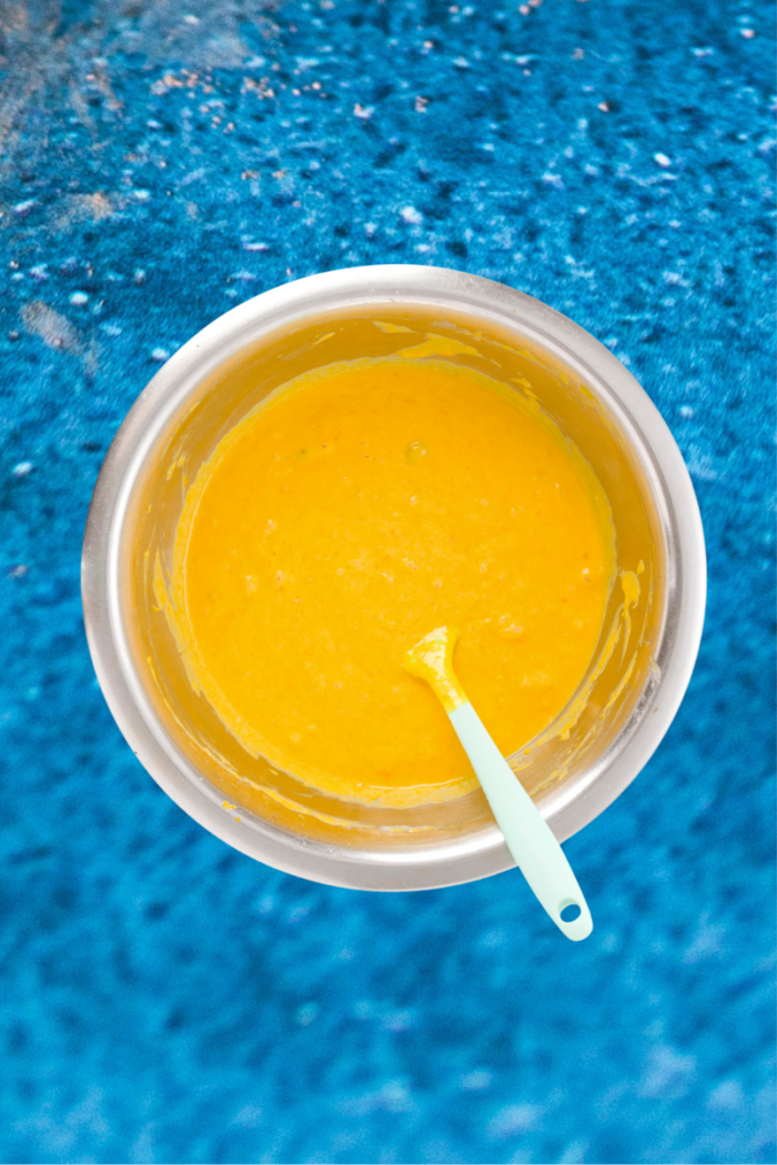 A bowl of pumpkin bread in a blue pool.