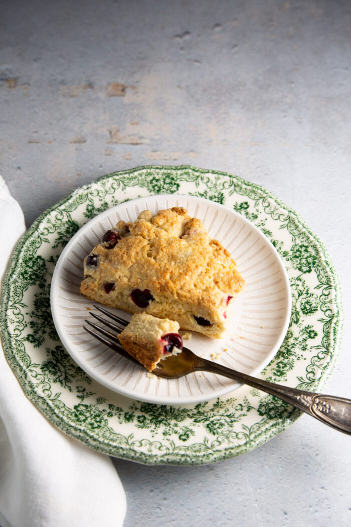 A piece of cranberry scones on a plate.