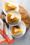 A slice of vegan cornbread on a plate with a fork.