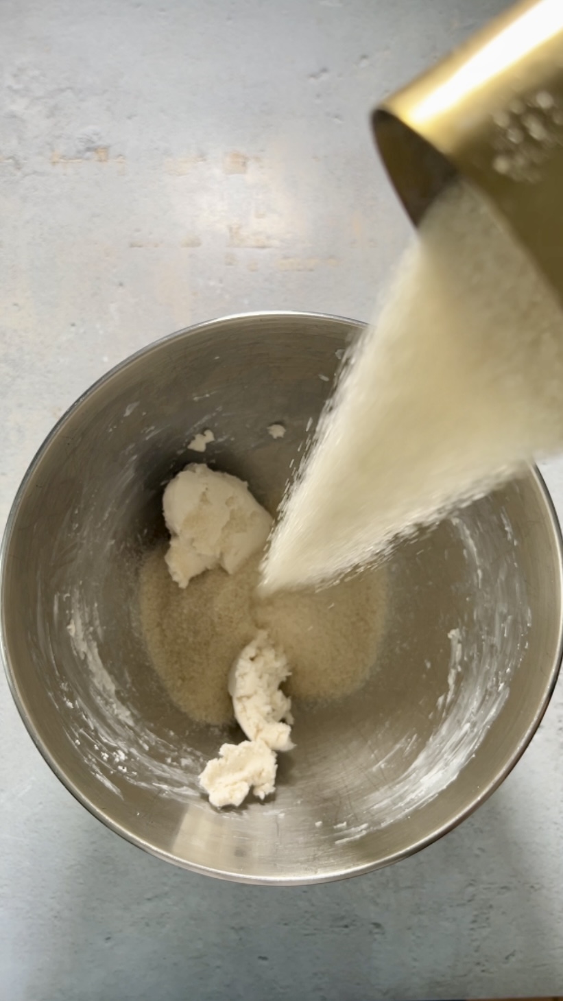Pour the whipped cream into a metal bowl.
