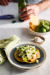 A plate of ceviche with hearts of palm on a table.